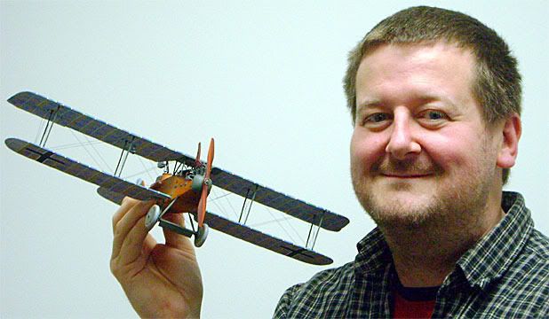 FINE DETAIL: Richard Alexander, of Peter Jackson's company Wingnut Wings, with a two-seater German LVG C VI from about 1918. Hours of painstaking work go into each model kit.  WINGNUT WINGS.