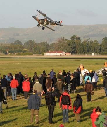 UP, UP, AND AWAY: One of the Vintage Aviator's World War I aircraft buzzes the crowd at the Anzac Air Show at Hood Aerodrome.  Photo: Fairfax Media.