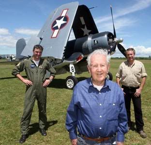 Jason Haggitt (left), Ray Richards and Gene DeMarco in front of the last Corsair FG-1D flown by a Kiwi. Veteran Ray Richards used to fly his own Corsair in the British fleet Air Arm.