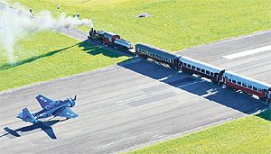 A MEETING OF ERAS: New Zealand's only operational Grumman Avenger World War 2 dive bomber waits for the Wa165 to pass as it crosses the runway at Gisborne Airport.  Photo: Paul Rickard.