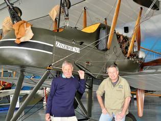 WINGED HISTORY: Masterton pilot Gene De Marco (right) shows Michael Bell an FE2b aircraft, a modern-day reproduction of the aircraft Mr Bell's father flew. — Photo: Susan Nikolaison.
