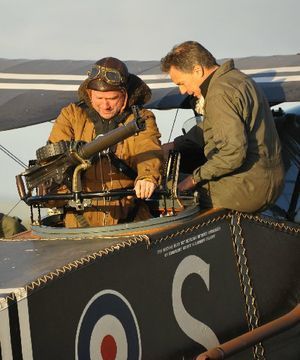 COCKPIT SEAT: Englishman Michael Perry climbs aboard an F2B Bristol fighter with chief pilot Gene de Marco.