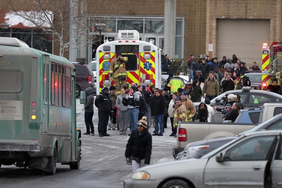 Police evacuate employees and patrons from the Columbia Town Center Mall after three people were killed in a shooting there on January 25th, 2014 in Columbia, Maryland. Police still do not have a motive for the shooting but believe the shooter has been killed. — Photo: Chip Somodevilla/Getty Images.