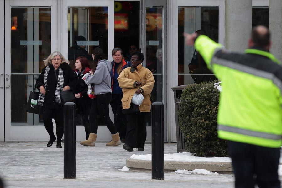 Police evacuate employees and patrons from the Columbia Town Center Mall after three people were killed in a shooting there on January 25th, 2014 in Columbia, Maryland. Police still do not have a motive for the shooting but believe the shooter has been killed. — Photo: Chip Somodevilla/Getty Images.