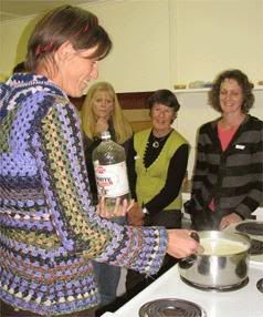 ALL EYES: Cheese workshop participants watch as Irma Jager makes paneer. — SALLY KIDSON/The Nelson Mail.