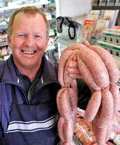 SAUSAGE SAVVY: Butcher Ian Groves won a gold award at the Great New Zealand Sausage Competition for his traditional pork sausage. — AMELIA JACOBSEN/Auckland Suburban Newspapers.