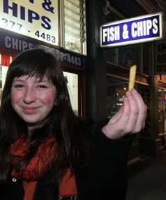 TASTES GOOD: Ellen Gray got a good scoop of chips last night with her fish and pineapple ring from City Fish and Chips shop.  DON SCOTT/The Press.