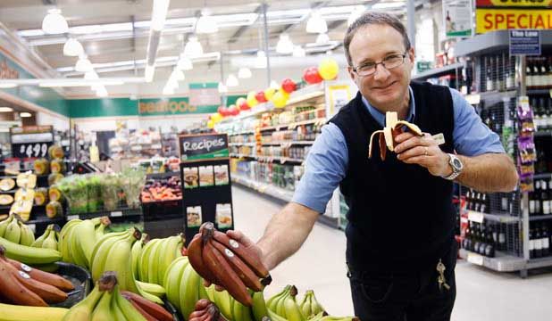 EXTRA EXOTIC: Browne St Countdown store manager Mark Walker tastes a new product to the supermarket, a red banana from Ecuador.  MYTCHALL BANSGROVE/Fairfax NZ.