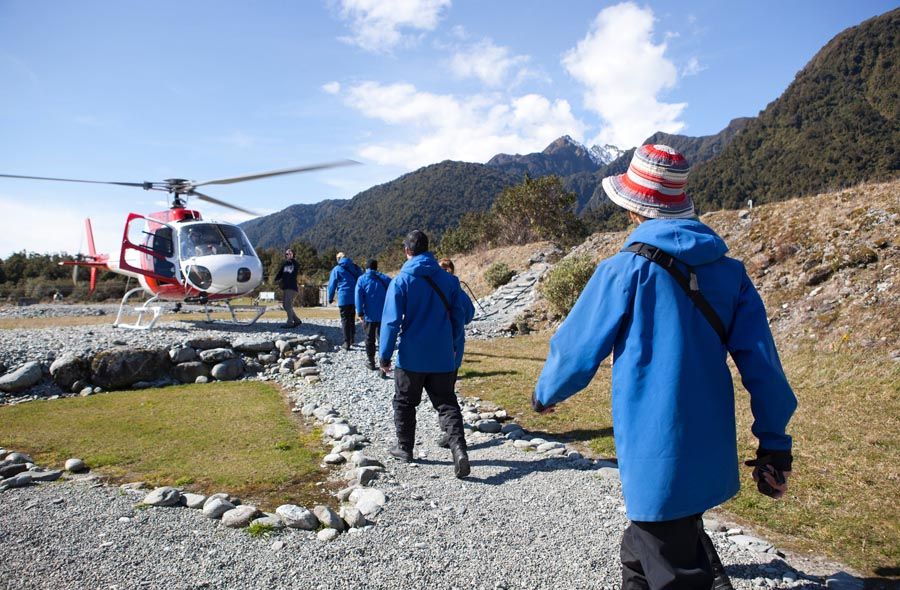 As glaciers retreat on South Island, getting to some of the popular sites requires a helicopter ride, no longer a hike. — Photo: Guy Frederick/The New York Times.
