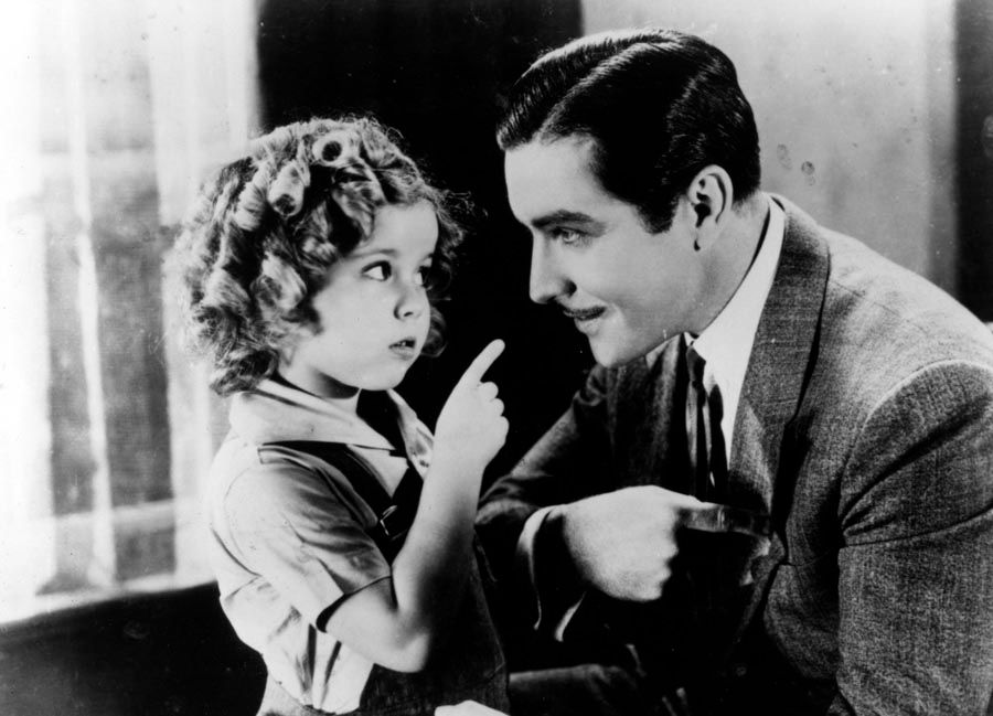 A scene from “Curly Top”, starring Shirley Temple, left, and John Boles.