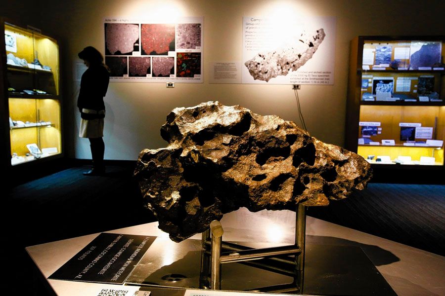 A 357-pound chunk of the Canyon Diablo meteorite, which carved out the mile-wide Meteor Crater in Arizona, is the centerpiece of UCLA's Meteorite Gallery, which comprises nearly 3,000 specimens from 1,500 individual meteorites. The museum opened to the public Friday. Admission is free. — Photo: Anne Cusack/Los Angeles Times/January 10th, 2014.