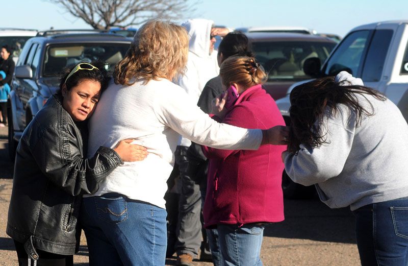 People wait for news at a staging ground area set up for parents after a shooting on Tuesday at Berrendo Middle School in Roswell, New Mexico. — Photo: Mark Wilson/Roswell Daily Record.