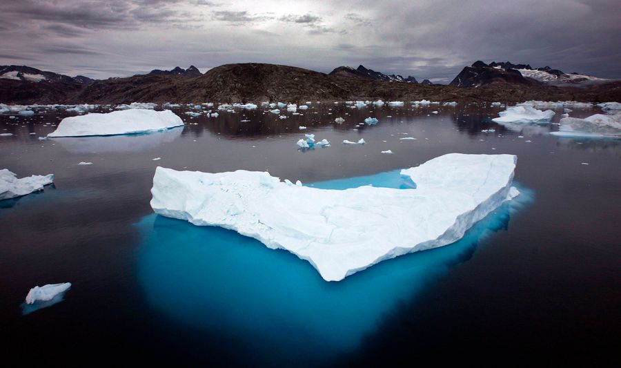 Icebergs float in a bay off Ammassalik Island, Greenland. — Photo: John McConnico/Associated Press.