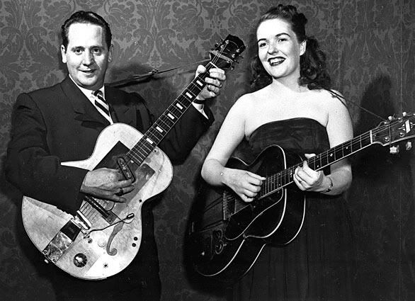 Les Paul | 1915-2009 — Les Paul and his wife, Mary Ford, perform on guitar. Paul, 94, the guitarist and inventor who changed the course of music with the electric guitar and multitrack recording, has died. — Associated Press/November 05, 1951.