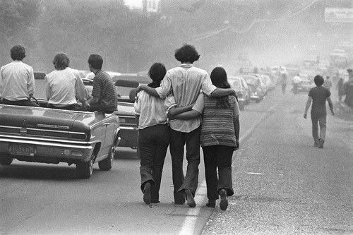 The traffic became inch-along dense miles from Max Yasgur's farm, where the festival was held. Thousands of youths headed toward fields where cattle had grazed the day before, and where artists like Jimi Hendrix and Joan Baez would make history. — Photo by Baron Wolman.