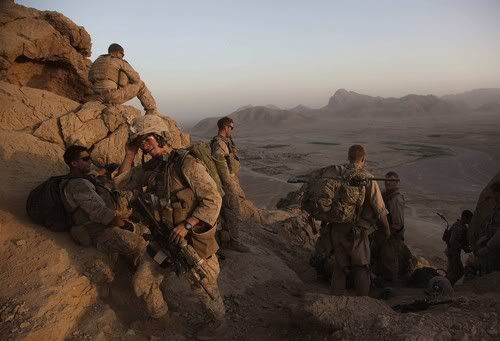 Lance Corporal Mark Chieffallo of Pittsburg arrives at an observation post on a peak above a village in Helmand province with over Marines.  Julie Jacobson/Associated Press/August 22, 2009.
