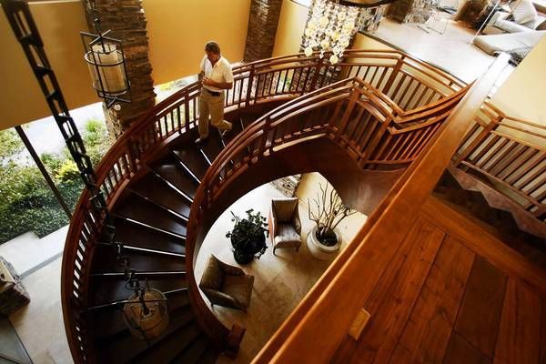 Daniel Coletti makes his way down a spiral wooden staircase inside his mountaintop home in Las Vegas. It sits on land bought by Howard Hughes in the 1950s.  Photo: Genaro Molina/Los Angeles Times/April 10, 2012.