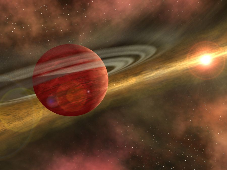 An artist's conception of a young planet in a distant orbit around its host star. The star still harbors a debris disk, remnant material from star and planet formation, interior to the planet's orbit.  Picture: NASA.