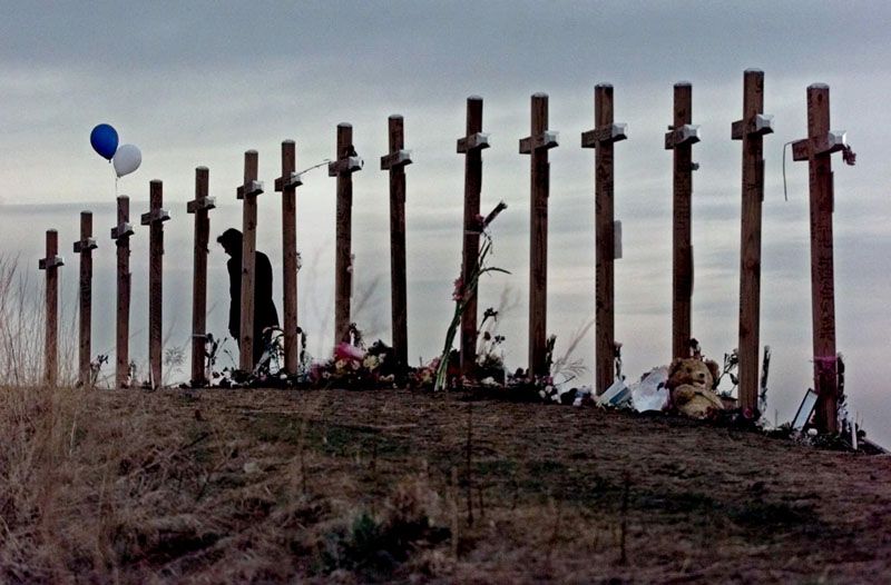 Fifteen crosses dot a hill in Littleton, Colorado, in April 1999 after a shooting rampage at Columbine High School. — Photo: Eric Gay/Associated Press/April 28th, 1999.