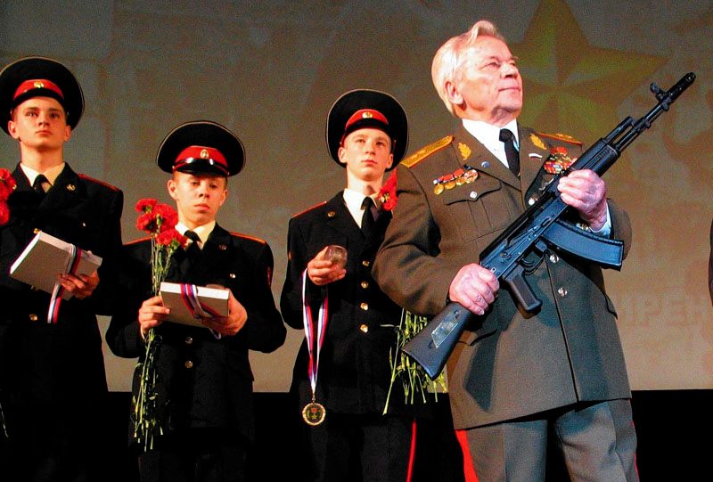 Mikhail Kalashnikov, shown in Moscow in 2004, holds his creation, the AK-47. By some estimates, it is the world’s most abundant firearm, with one for every 70 of the men, women and children on Earth. — Photo: Sergei L. Loiko/Los Angeles Times/May 6th, 2004.