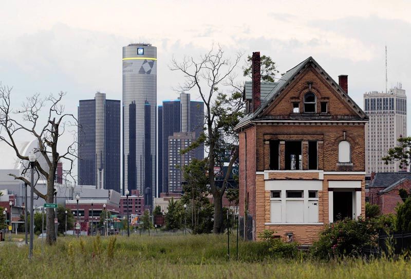 The global headquarters of General Motors is visible from one of Detroit's many abandoned lots. The city declared bankruptcy Thursday.  Photo: Jeff Kowalsky/Bloomberg.
