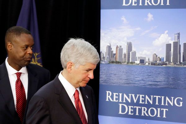 Michigan Governor Rick Snyder, right, and state-appointed emergency manager Kevyn Orr leave a news conference in Detroit about the city's bankruptcy filing. — Photo: Carlos Osorio/Associated Press.