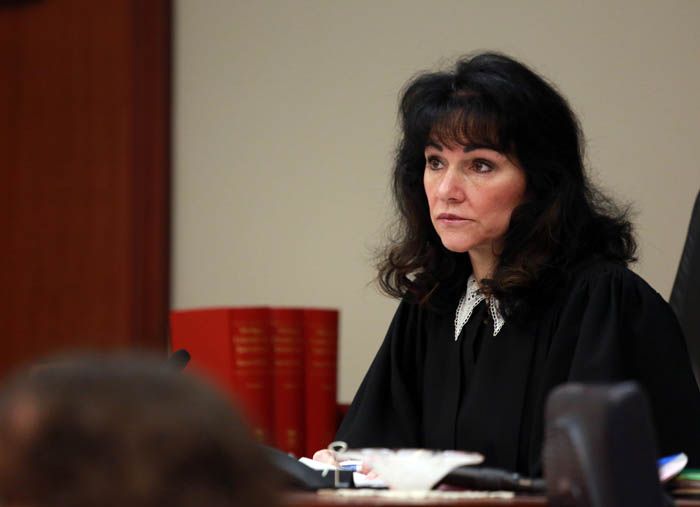 Ingham County Circuit Court Judge Rosemarie Aquilina adjourns a hearing on a lawsuit filed by Detroit pension funds trying to keep city retirees' payments from being cut during bankruptcy proceedings. — Photo: Kathleen Galligan/Associated Press.