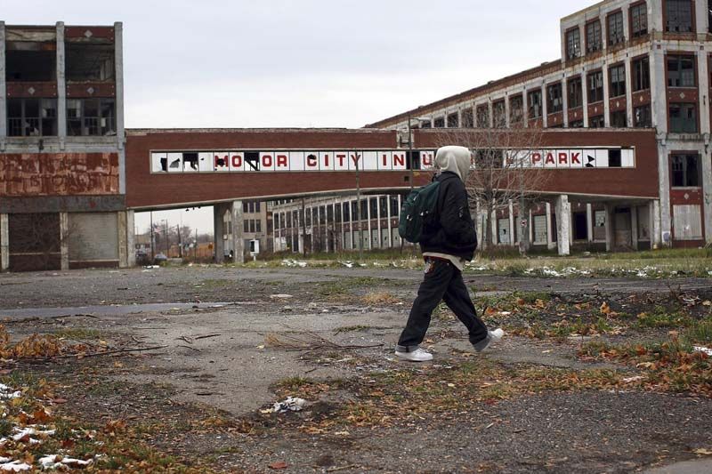 Detroit filed for Chapter 9 bankruptcy protection. Above: A person walks past the remains of the Packard Motor Car Company. — Photo: Spencer Platt/Getty Images.