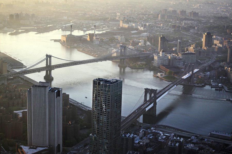 This file photo of May 10th, 2013 shows view of the Manhattan Bridge, left, and Brooklyn Bridge as seen from the 105th floor of One World Trade Center, in New York. Seven months after Superstorm Sandy swamped New York, Mayor Michael Bloomberg proposed a nearly $20 billion plan Tuesday, June 11th, 2013, to protect the city from the effects of global warming and storms. — Photo: Mark Lennihan/Associated Press.