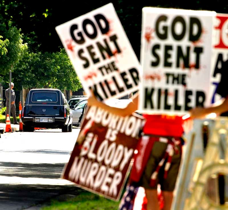 Westboro Baptist Church members protest at the funeral in Wichita, Kansas, for George Tiller, a doctor who provided abortions, after he was killed by an antiabortion activist in 2009. In 2011, after the family of a slain soldier sued church leaders over a protest at a funeral, the Supreme Court ruled the action was protected by free-speech rights under the 1st Amendment.  Photo: Charlie Riedel/Associated Press.