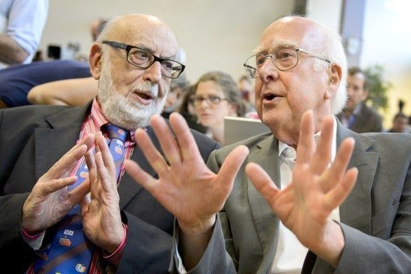 A file photo taken on July 4th, 2012 shows British physicist Peter Higgs (right) speaking with his Belgian counterpart Francois Englert during a press conference at the European Organization for Nuclear Research (CERN) offices in Meyrin near Geneva. Francois Englert of Belgium and Peter Higgs of Britain won the Nobel Physics Prize on October 8th, 2013. — Photo: Fabrice Coffrini/AFP/Getty Images.
