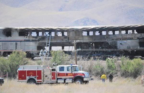 Charred Amtrak passenger cars sit smoldering after the train was struck by a semitruck on Highway 95 north of Fallon, Nevada. — Photo: Liz Margerum/Reno Gazette-Journal/Associated Press/June 26, 2011.
