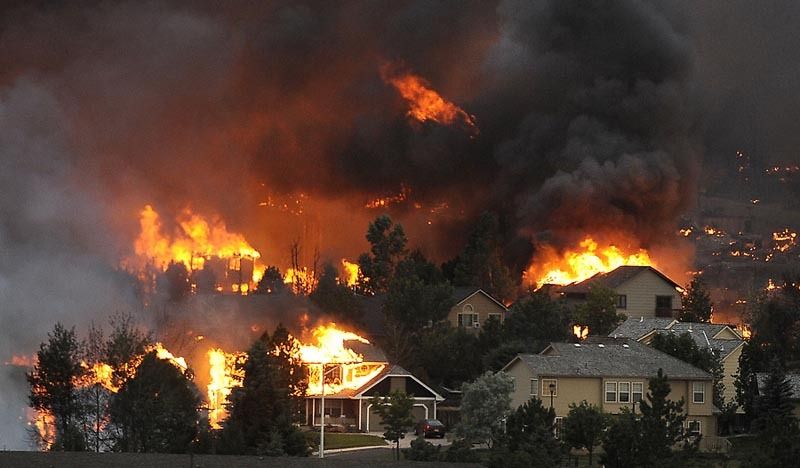 The Waldo Canyon fire roars through a neighboord in the foothills near Colorado Springs, Colorado. — Photo: Helen H. Richardson/Denver Post/June 26, 2012.