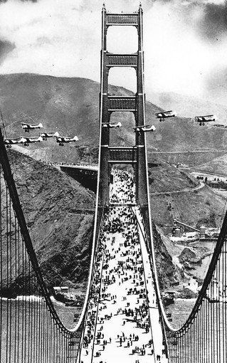 MILITARY BIPLANES fly between spans of the Golden Gate Bridge during opening day gala in 1937.  Photo: Associated Press.