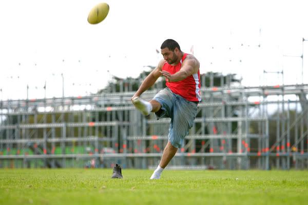 HOPING TO BE NOTICED: Scaffolder David Anderson, from Wellington, takes a break from work to kick a ball around. — ROBERT KITCHIN/The Dominion Post.