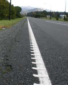 VIBRATOR: A rumble strip along the side of State Highway 1.