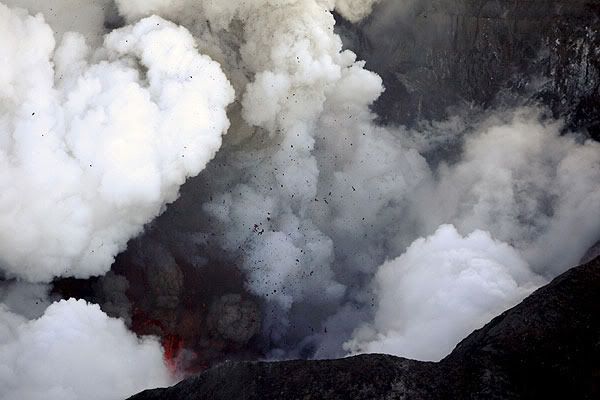 LESS ASH: Molten lava shoots out of an erupting volcano near Eyjafjallajokull.  REUTERS.