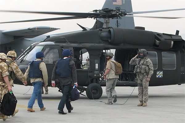 Prime Minister John Key boards a helicopter on the way to visit SAS troops in Kabul.  Photo: NZPA.