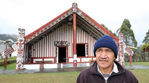 SENSE OF BELONGING: Ron Tahi outside the wharenui, opened in 1888, at Mataatua Marae. He was raised in Ruatahuna by his grandparents. “When I was growing up, I felt that all the bush around me was just part of my home.” — PETER DRURY/Waikato Times.