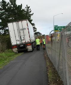 BIG TOW: A large tow truck came to the rescue after having to pull down an area of fence.  Photo: JONATHAN BIXLEY.