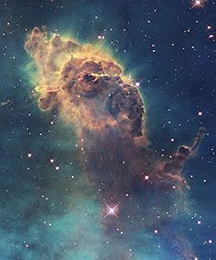 FAR, FAR AWAY: Gas pillars in the Eagle Nebula.  Photo: NASA.