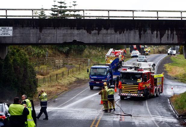 IMPACT POINT: A large hole on the Egmont Road rail overbridge shows where the truck carrying a digger hit it on Tuesday.  ROBERT CHARLES/Taranaki Daily News.
