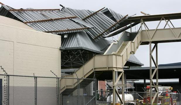 BAD BREW: Gusts peeled back the roof of the old Lion Nathan brewery building beside Auckland's Newmarket railway. — Photo: Sunday News.