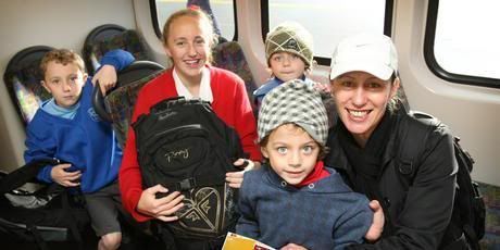 Leah Robinson with her young family Noah (7, left) Eva-Rae (12) and 4-year-old twins Will (front) and Jude on the 8.15am train from Onehunga that left from the newly opened platform yesterday. — Photo: Greg Bowker.