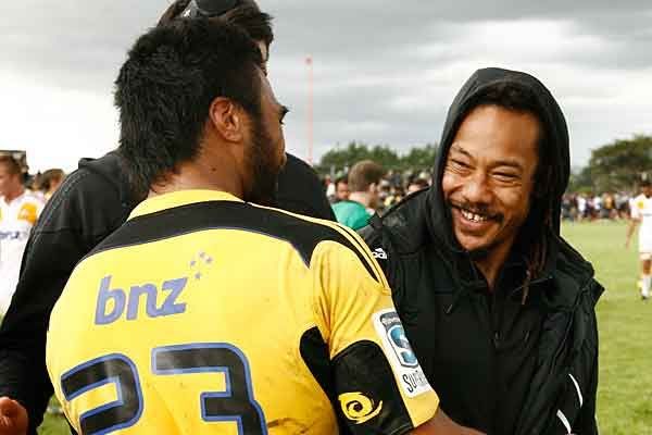 Old teams mates Victor Vito, left, and Tana Umaga share a joke after the game.  PHIL REID/The Dominion Post.