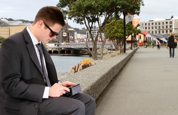 OUTDOOR BROWSING: Freddie Leckie, 20, uses the wireless internet on the waterfront in Wellington.  LUKE APPLEBY/The Dominion Post.