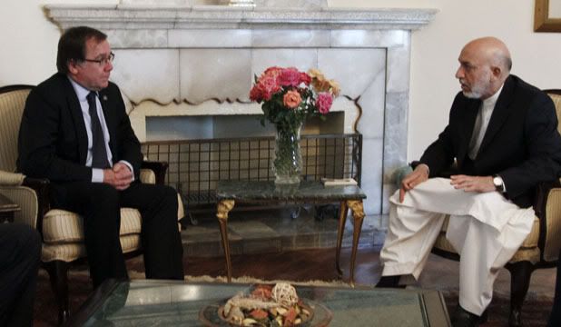 CORRUPT: New Zealand's association with Hamid Karzai's crooked Afghanistan government  pictured is Karzai meeting Foreign Minister Murray McCully in 2010  has tainted our international standing.  Photo: REUTERS.