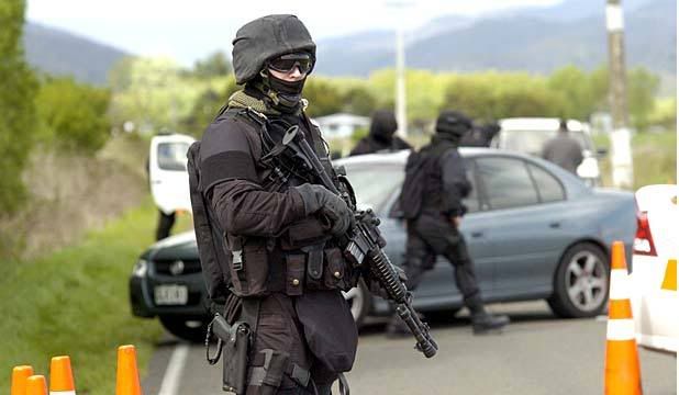 POLICE RESPONSE: Armed police man a roadblock in Ruatoki Valley during the 2007 terror raids.  Photo: Whakatane Beacon.