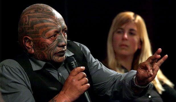 STILL FIGHTING: Tame Iti, left, and Valerie Morse, seen here at an exhibition opening. Iti is still facing charges but the charges against Morse have been dropped. — Photo: WARWICK SMITH.