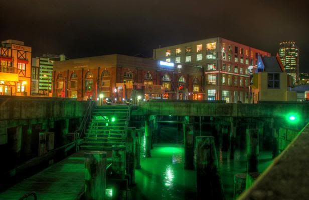 The green light-lit area showing the water beneath the waterfront walk with the Macs Brewery Bar in the background. — LUKE APPLEBY/Dominion Post.